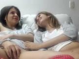 Two gils masturbate together
