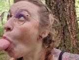 Slut sucks a dildo in the woods