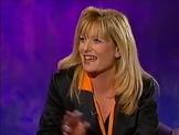 Gaby Roslin black satin suit