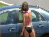 Candid Brunette Washing Car
