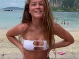 Teen showing off hot bikini on the beach