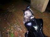 Asian latex slave exercised outside