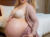 Cute Pregnant Toy rubs her belly